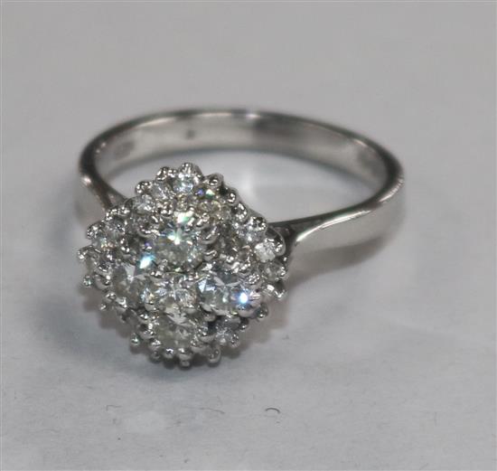 A modern 18ct white gold and diamond cluster ring size M.